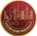 Circular maroon badge with a meditating figure in front of a city skyline and the border text Escorts DOWNTOWN DUBAI.